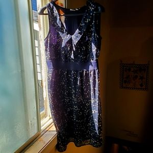 Cute dress with ruffle detail at the front .